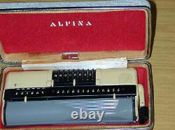 Alpina Rum Calculator In Suitcase